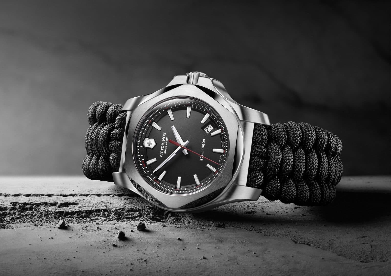 Victorinox I.N.O.X. watch with Naimakka paracord strap on concrete surface